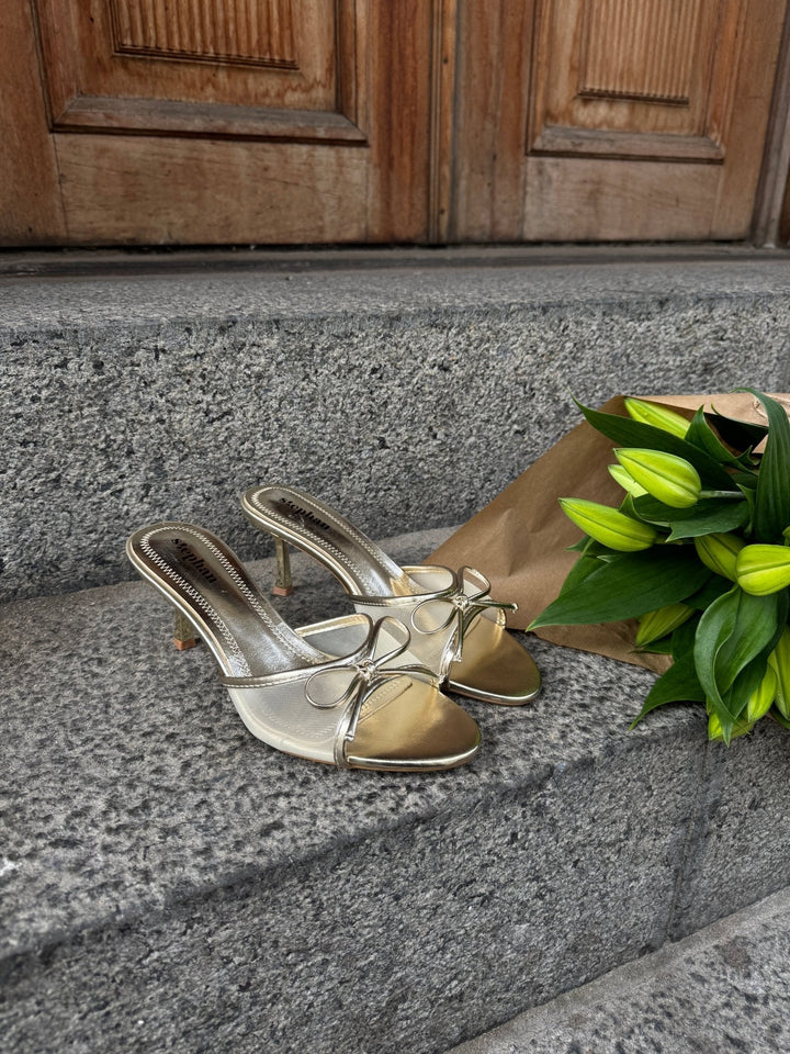 Nellie Bow Tie Heeled Mules - Gold